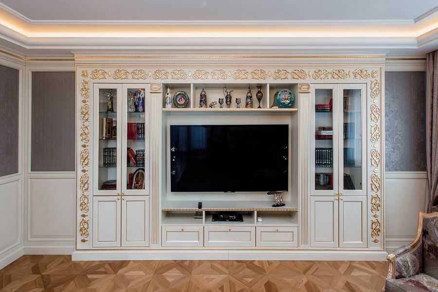 Угловая стенка в гостиную (48 фото): мини-модели для одежды и круглые варианты со шкафом под телевизор для зала в стиле классики и хай-тек