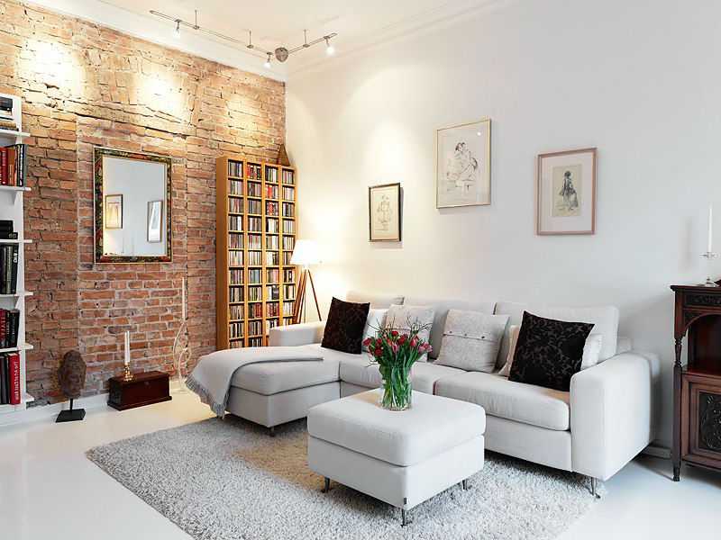 Кирпичная стена в интерьере гостиной (41 фото): примеры использования белого кирпича в интерьере, оформление декоративными кирпичиками комнаты в стиле лофт