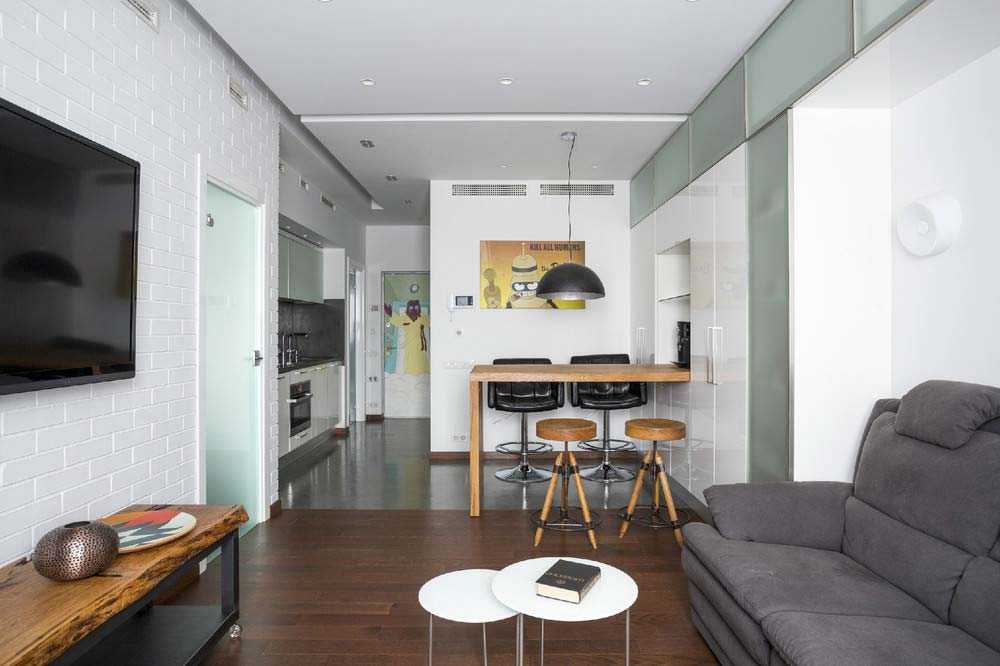 Дизайн кухни-гостиной площадью 30 кв. м имеет свои особенности.  Какой стиль выбрать для кухни-студии Как зонировать пространство при помощи мебели, освещения, перегородок и барной стойки