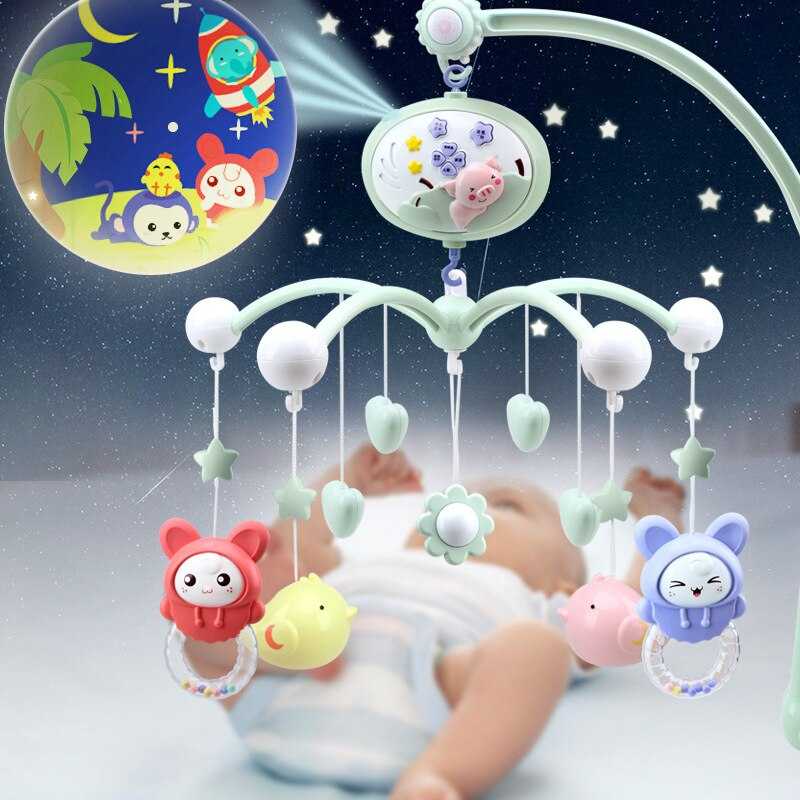 Игрушки на кроватку для новорожденных: виды и советы по выбору
