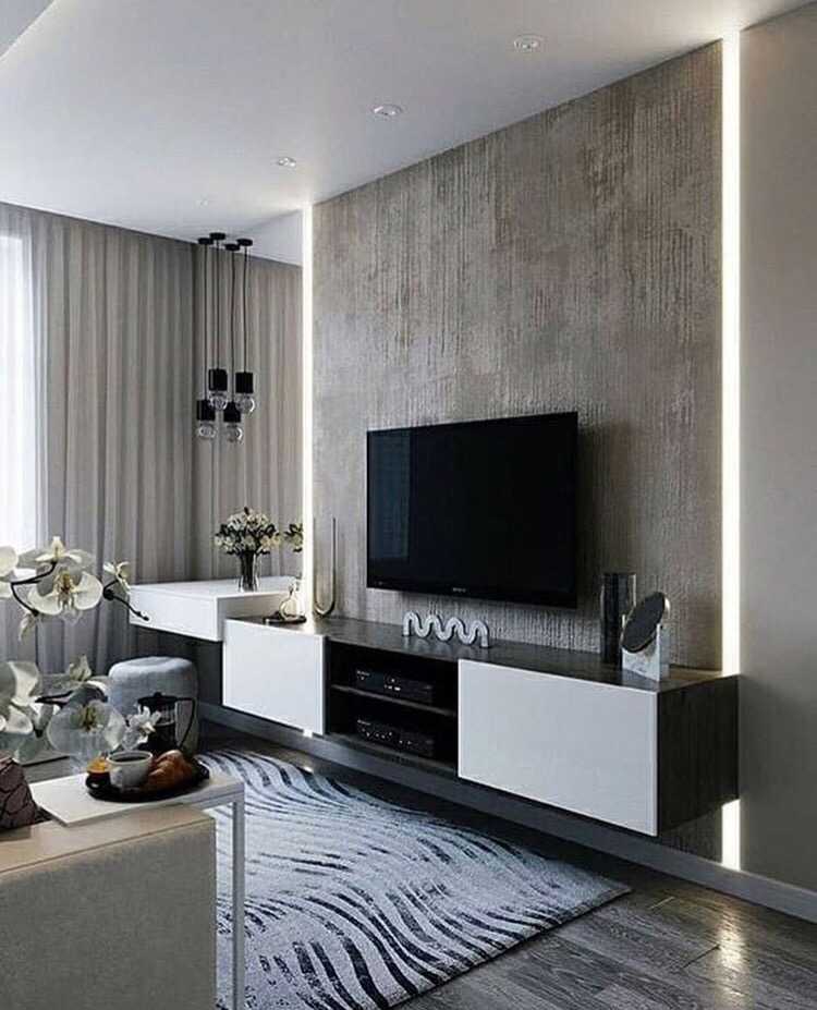 Высота установки телевизора в гостиной и оформление стены